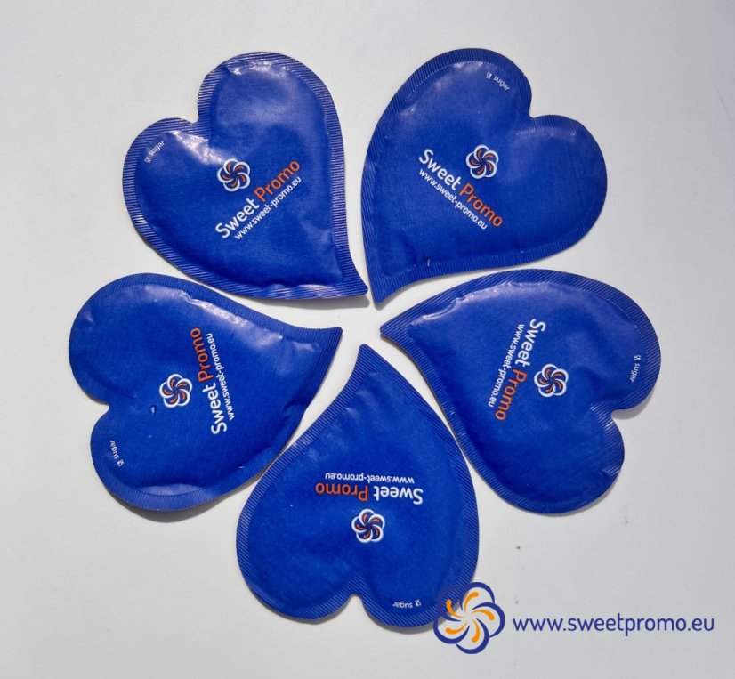 Blue heart-shaped promotional sugar with your own print. Originally packaged sugar for coffee and tea, suitable for hotels, restaurants, corporate events and catering, trade fairs and conferences.