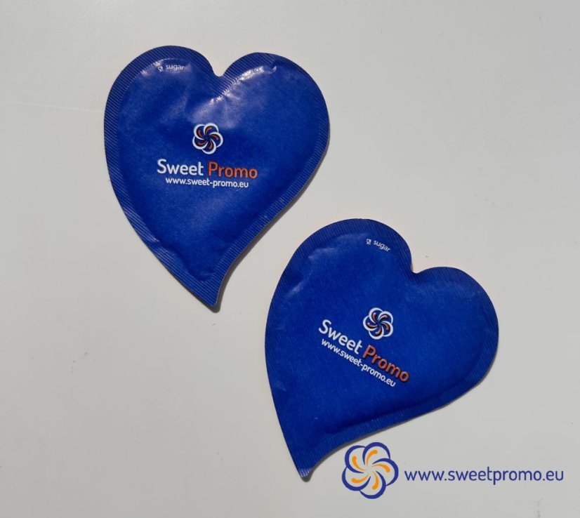 Blue heart-shaped promotional sugar with your own print. Originally packaged sugar for coffee and tea, suitable for hotels, restaurants, corporate events and catering, trade fairs and conferences.