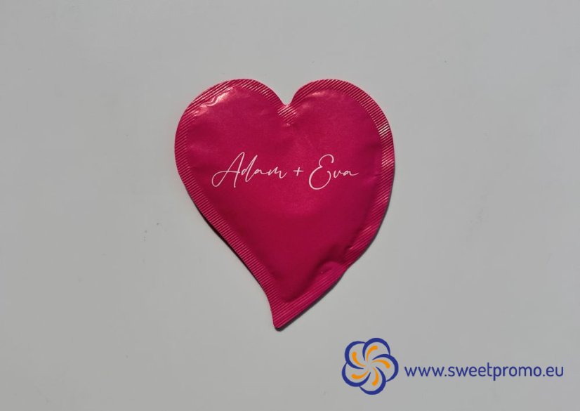 Pink heart-shaped promotional sugar with your own print. Originally packaged sugar for coffee and tea, suitable for hotels, restaurants, corporate events and catering, trade fairs and conferences.