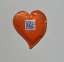 Orange heart-shaped promotional sugar with your own print. Originally packaged sugar for coffee and tea, suitable for hotels, restaurants, corporate events and catering, trade fairs and conferences.