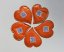 Orange heart-shaped promotional sugar with your own print. Originally packaged sugar for coffee and tea, suitable for hotels, restaurants, corporate events and catering, trade fairs and conferences.